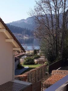 a view of a lake from a house at appartement Gérardmer proche lac et centre ville in Gérardmer