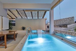 The swimming pool at or close to 2 bedroom Villa with heated swimming pool-Spa whirlpool-BBQ!