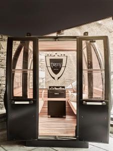 an open door with a sign on the side of a building at Firefly Luxury Suites in Zermatt