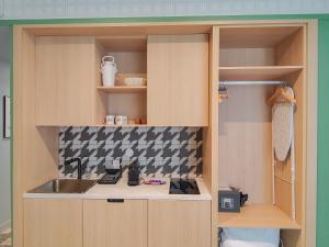 a kitchen with a sink and a counter top at Aparthotel AMMI Nice Lafayette in Nice