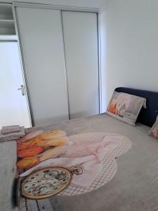 a bedroom with a bed with a painting on it at Ana in Neum