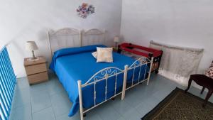 Postel nebo postele na pokoji v ubytování House Sasanelli