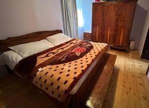 Postel nebo postele na pokoji v ubytování Jachvliani Guest House