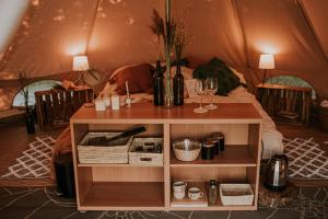 a table in a room with a tent at Szykidym in Hartowiec