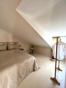 a bedroom with a white bed with a roof at lo͝or luxury retreat in Split