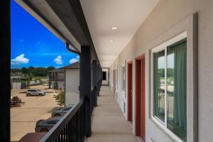 a balcony with a view of a parking lot at Scottish Inns- Forest Hill in Forest Hill +4 photos