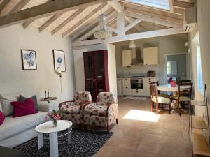 a living room with a couch and a table at Monte Teu in São Luis