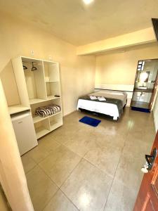 Cama ou camas em um quarto em Pousada Serra de São Thomé