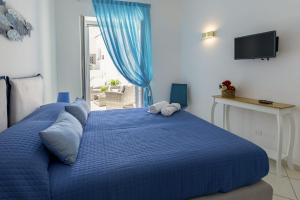 Una cama o camas en una habitación de Casa Borgo Sant'Angelo