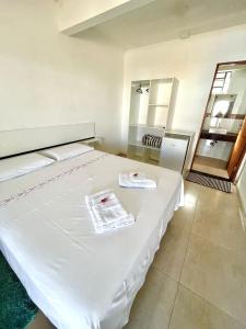Cama ou camas em um quarto em Pousada Serra de São Thomé