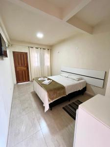 Cama ou camas em um quarto em Pousada Serra de São Thomé
