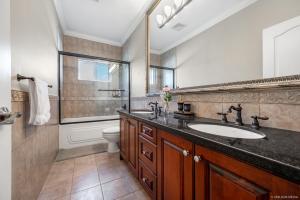 a bathroom with a sink and a shower at Share Home 1BD suite in Coquitlam in Coquitlam