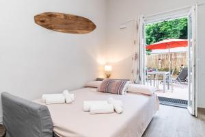 Postel nebo postele na pokoji v ubytování Portofino's Little Nest con Parcheggio Wi-Fi e aria condizionata