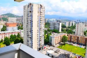 a view of a city with a tall building at Apartman Amigo-Free public parking in Sarajevo