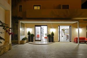 a lobby of a building with an open door at Best Western Hotel Martello in Lampedusa