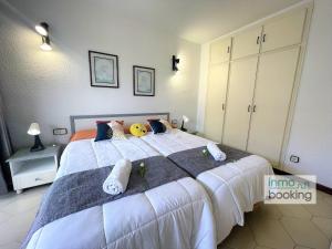 Posteľ alebo postele v izbe v ubytovaní Novelty Beach 2 Salou, climatizado, piscina y playa