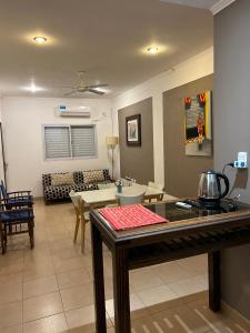 a living room with a couch and a table in a room at Aromas de Azahar in Bella Vista