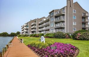 a large apartment building next to a body of water at Harbour Island 402L home in Ocean City +17 photos