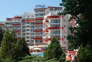 a large apartment building with a pool in front of it at Hotel Fenix in Sunny Beach