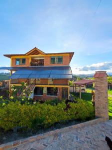 Villa Libertad في بايبا: منزل أمامه طائرة ورقية