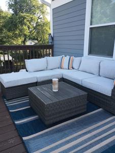 a porch with a couch and a table on a house at Nice & Near Downtown Nashville in Nashville