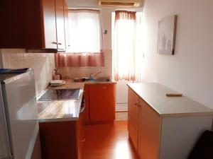 a kitchen with a sink and a counter top at IRINIS HOUSES in Rhodes Town