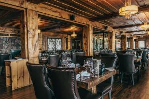 a dining room with a table and chairs at The Historic Lutsen Lodge in Lutsen