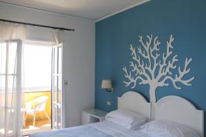 Postel nebo postele na pokoji v ubytování Sunbay Park Hotel