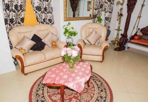 Un lugar para sentarse en Heathrow Garden House - West Drayton, London - Benjamin Guest House