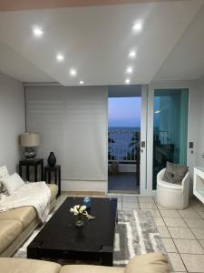 a living room with a couch and a coffee table at The Vue at Dos Marina in Fajardo