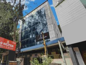 a building with a sign in front of it at G Silver Ashok Nagar in Chennai