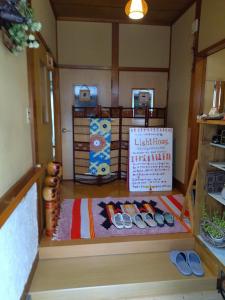 a model of a kitchen with a table and a sign at 民家の一室1 Private Room in Japanese Vintage House with Tatami, Single Bed, Free Parking, Good to Travel for Tashiro Cats Island in Ishinomaki