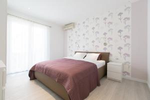 Posteľ alebo postele v izbe v ubytovaní Apartment Esperansa + 34 fotografií