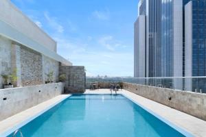 a swimming pool on the roof of a building at Elegant One Bedroom in Westlands in Nairobi