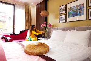 Postel nebo postele na pokoji v ubytování Art Hotel Ha Noi