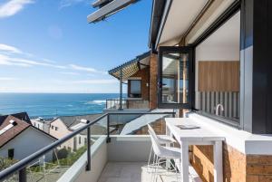 a balcony with a view of the ocean at Namanula 7 - oceanstays in Yamba