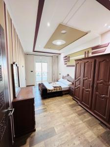 Rúm í herbergi á Abraj Dubai Larache
