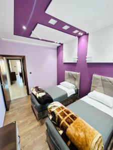 Кровать или кровати в номере Abraj Dubai Larache