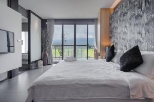 Postel nebo postele na pokoji v ubytování Jiaoxi 320 B&B