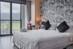 Voodi või voodid majutusasutuse Jiaoxi 320 B&B toas