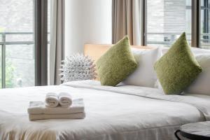 Postel nebo postele na pokoji v ubytování Jiaoxi 320 B&B