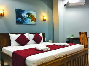 SP Tourist Hotel Jaffna客房内的一张或多张床位