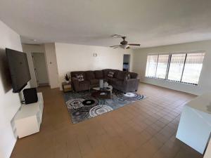 a living room with a couch and a rug at Lakeside retreat - 3 Bedroom, 2 Bathroom house by the lake in Lakeland