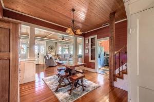 a dining room and living room with a wooden ceiling at DT 292 Star Haus in New Braunfels