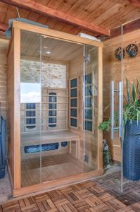 a sauna with a glass shower in a room at Apartments Ruža Dragove Dugi otok in Dragove