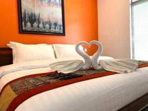 Een bed of bedden in een kamer bij Rebungan Resort Langkawi