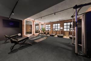 a gym with treadmills and cardio equipment in a room at Veriu Collingwood in Melbourne