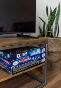 two stacks of dockedocked video game consoles on a table at At Forest Stay in Margaret River Town