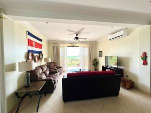 a living room with a couch and a table at Oceanview Rancho with Two bedroom & Two baths in Coco