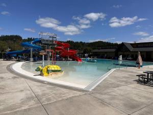 a water park with a water slide in a pool at The Alfred, Downtown Chehalis in Chehalis